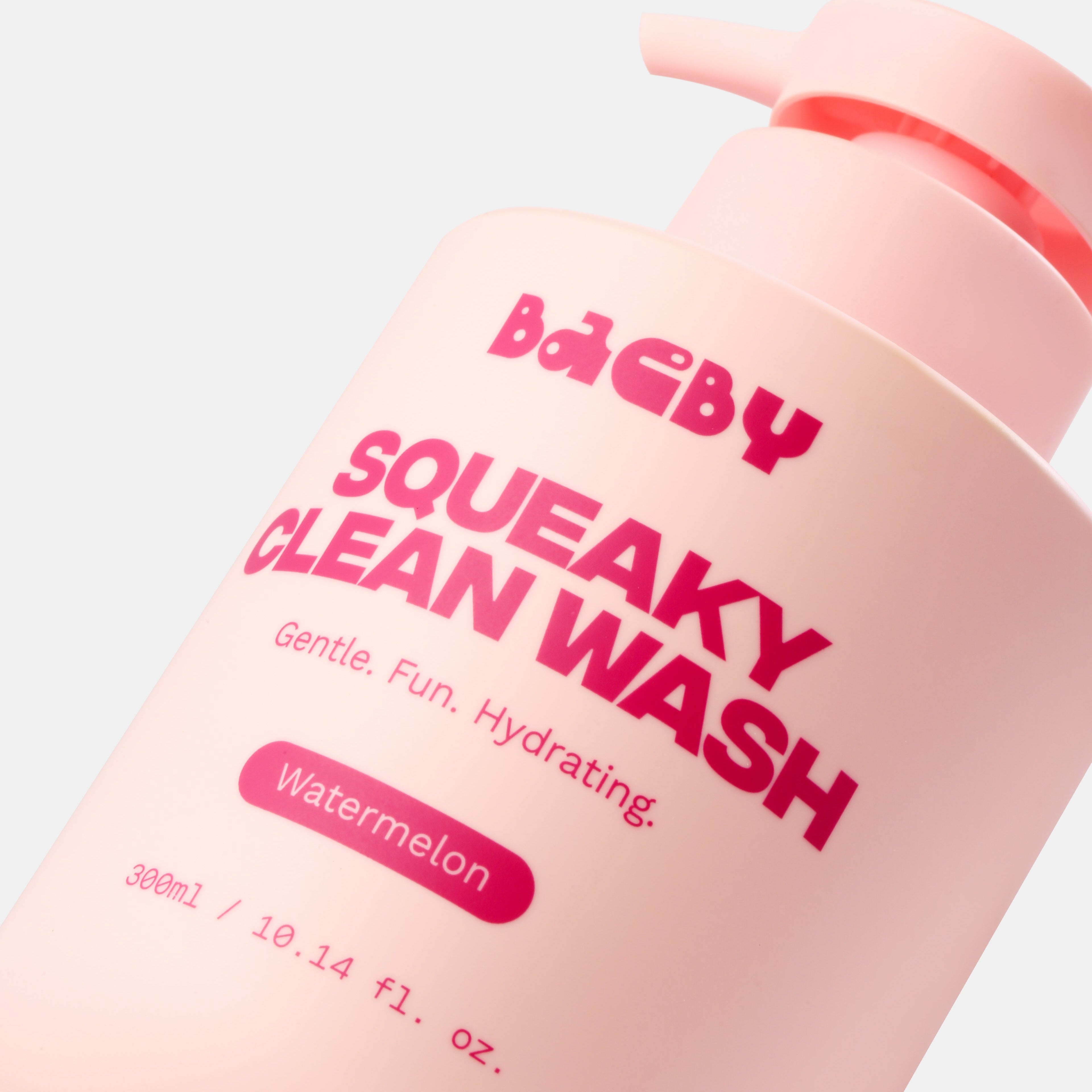 Pink bottle of Baeby Squeaky Clean Wash with red text on a light pink background